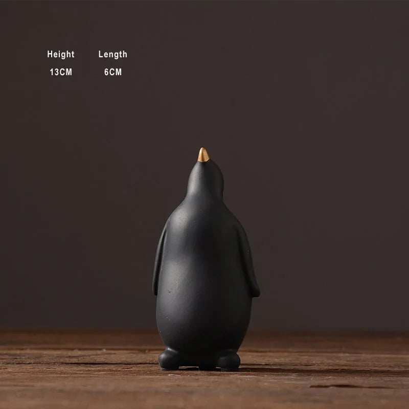Figuras Decorativas de Pingüinos en Cerámica (Acabado en Oro)